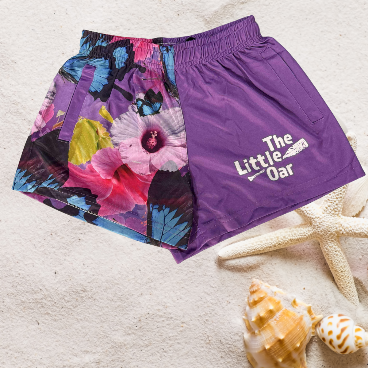 Princess Kids Shorts on a sandy background with starfish and shells.