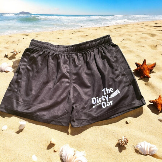 The Dirty Oar Shorts on a sandy beach background.