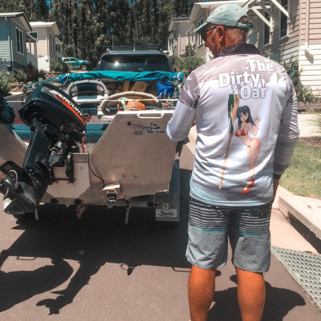 Man stading in front of boat wearing The Dirty Oar Mens Fishing Shirt White