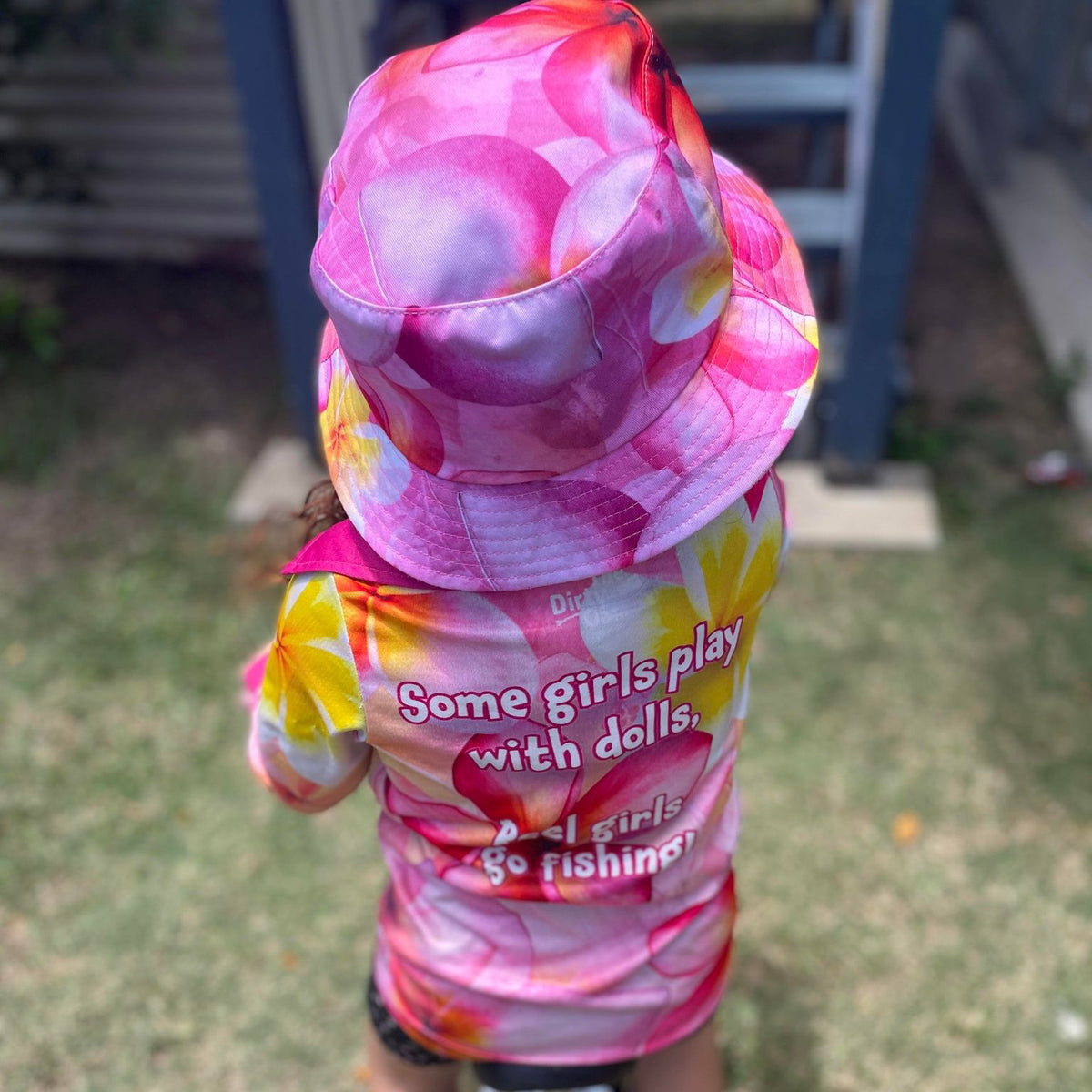 child wearing Frangipani Kids Bucket Hat and Frangipani kids Fishing Shirt.