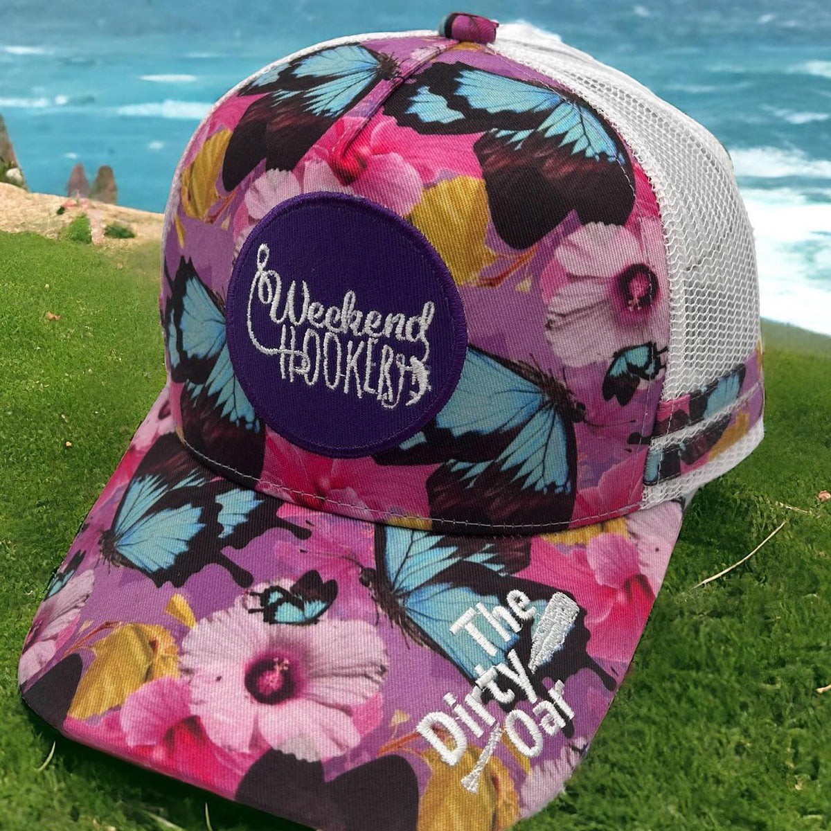 Princess Ponytail Trucker Cap on a grass background.