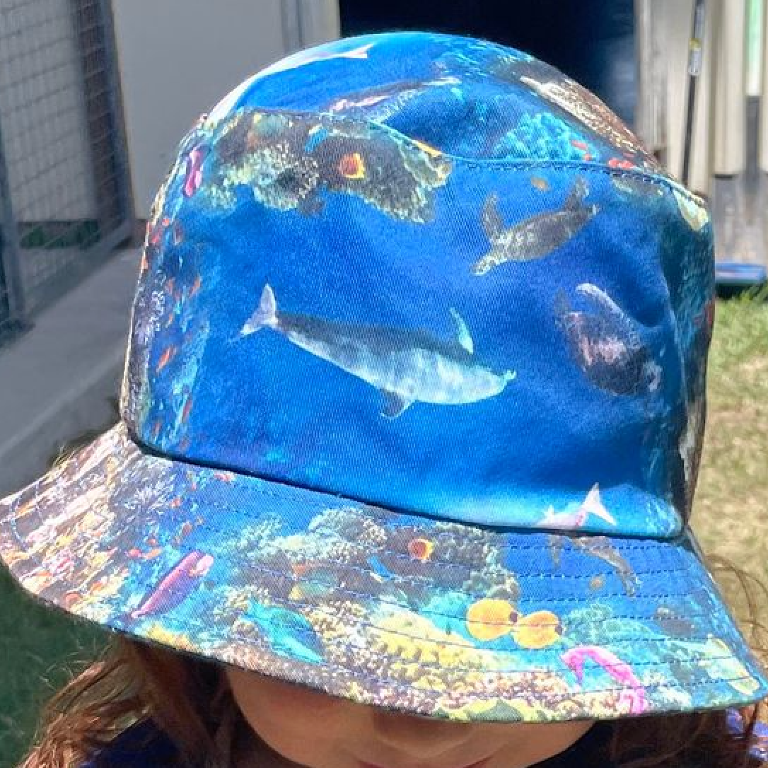 The Reef Kids Bucket Hat on Childs head